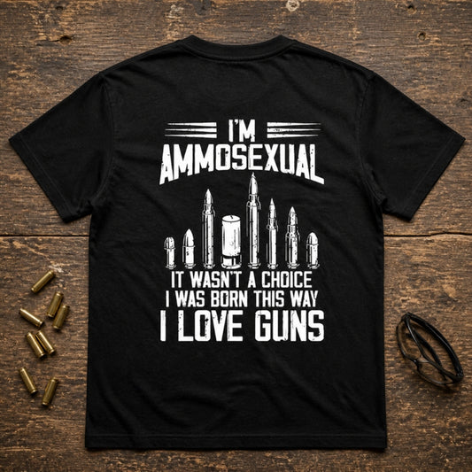 I'm Ammosexual graphic on the back of a black Royal Arms USA tee, flat lay with brass casings
