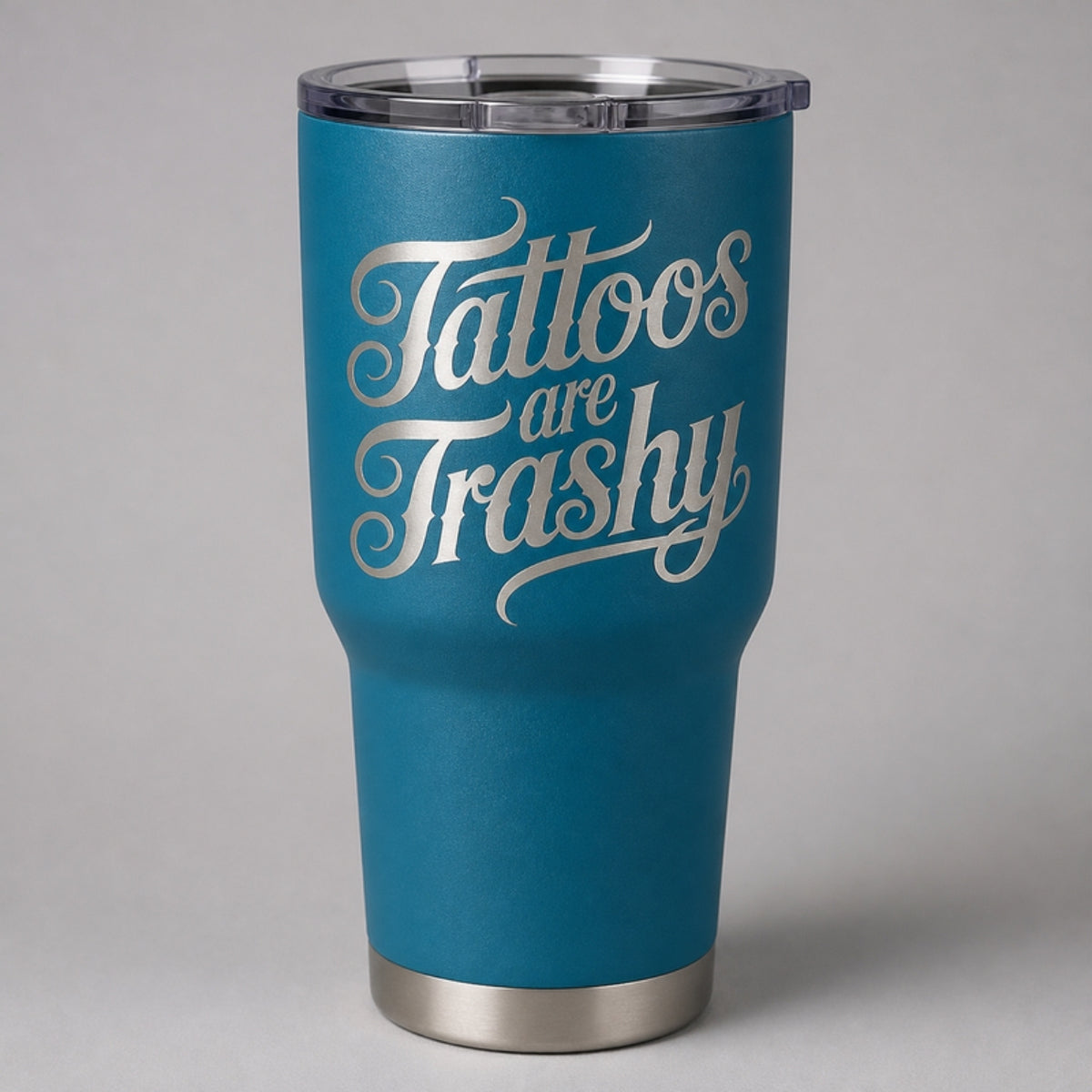 Tattoos Are Trashy tumbler, teal Cerakote with laser engraving