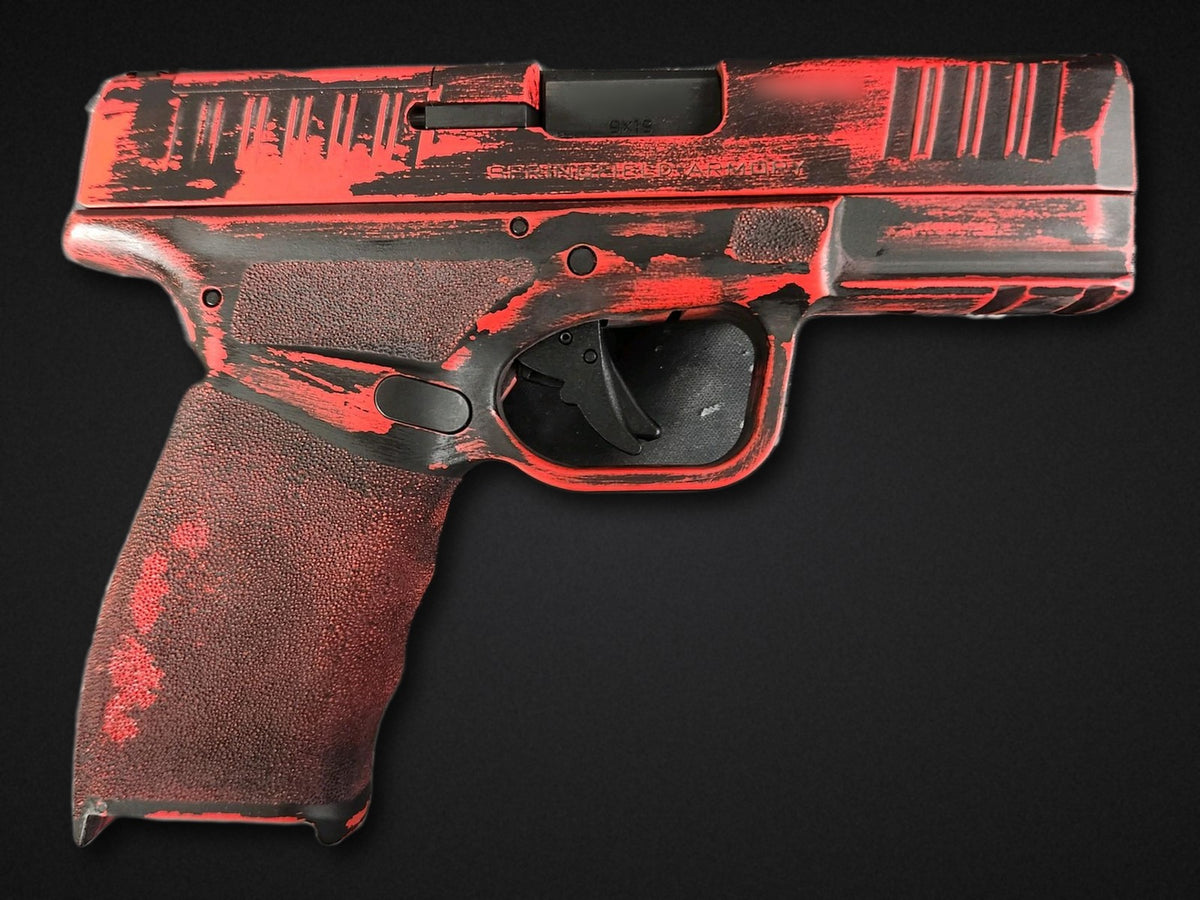 Custom Cerakote pistol - distressed red and black battleworn